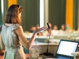 Female speaker at Business Conference and Presentation. Audience at the conference hall. Business and Entrepreneurship. Business woman. Horizontal composition.